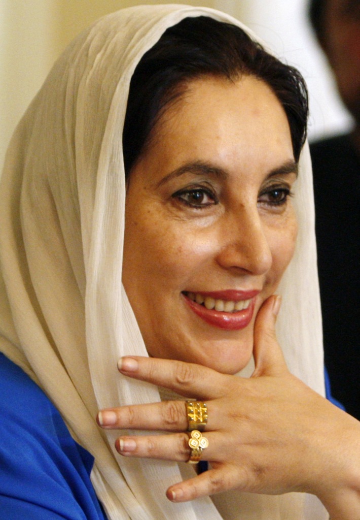 Opposition leader Benazir Bhutto smiles while meeting with leaders of the Pakistan People's Party at her residence in Karachi in this November 20, 2007 file photo. Bhutto was killed in a gun and bomb attack after a rally in the city of Rawalpindi on December 27, 2007, her party said. REUTERS/Adrees Latif/Files (PAKISTAN)